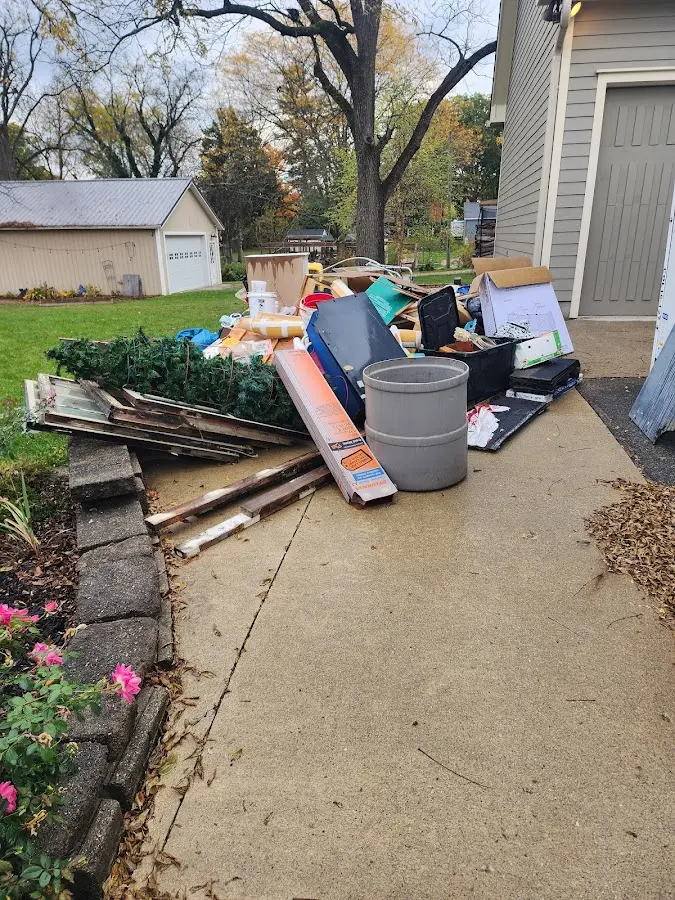 Dumpster being loaded with debris for 30 Yard Dumpster Rental in Haddon
